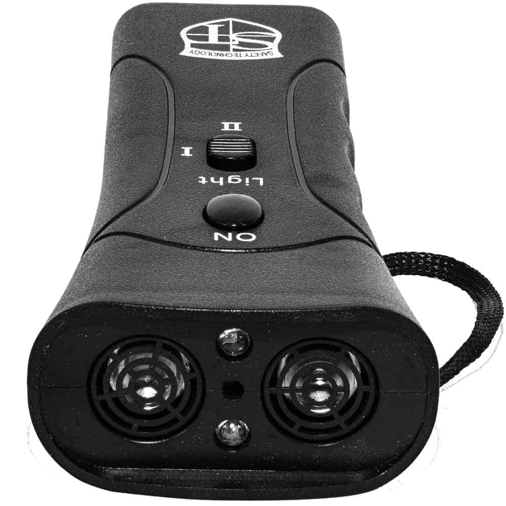 Handheld black ultrasonic dog repeller with control buttons, for pet training and deterrent use.